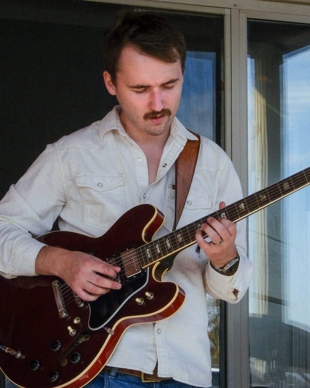 Tyler Furrer playing guitar